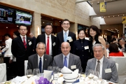 The Cluba?s Executive Director, Charities Douglas So (back row, centre), Corporate Business Planning and Programme Management Director Scarlette Leung (back row, 2nd right), Kitchee Foundation Chairman Kenneth Ng and spouse (back row, 2nd left and 1st right), Po Leung Kuk Chief Executive Officer James Chan (back row, 1st left), Tung Wah Group of Hospitals Chief Executive Stephen Ng (front row, left), Hong Kong Football Association Chief Executive Officer Mark Sutcliffe (front row, centre) and Hong Kong Wushu Union Vice President cum Hon Secretary Wan Hing-yuen (front row, right).