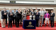 Member of the Legislative Council Ma Fung-kwok (front row, 3rd left) presents The Hong Kong Jockey Club Community Trophy to Dr & Mrs Gene Tsoi, owner of the winning horse Mr Gnocchi.