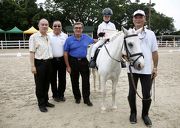 Photo 1, 2, 3: <br>
Club Chairman T Brian Stevenson (in blue shirt) enjoys a demonstration done by members of the Hong Kong Riding for the Disabled Association and presents certificates to the riders.  