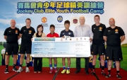 The Cluba?s Head of Charities Projects Rhoda Chan (3rd left), HKFA Technical Director Steve Oa?Connor (3rd right) and MUSS coaches present a boarding pass to Best Performers Robert Wong (4th left) and Kenny Wong (4th right).