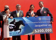 Club Chairman T Brian Stevenson (3rd right) and Club Deputy Chairman Dr Simon S O Ip (1st right), who is also President of the Hong Kong Equestrian Federation, present a performance award of HK$200,000 to Jacqueline Lai (2nd right) in recognition of her winning the individual silver medal at the 12th National Games in Shenyang.
