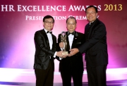 The Cluba?s Head of Telebet Services Peter Ng (left) and Head of Human Capital Development Barry Ip (right) receive the Excellent Learning & Development Award from Secretary for Labour and Welfare Matthew Cheung Kin-chung.  
