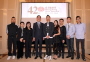 The Cluba?s Executive Director, Charities, Douglas So (4th left), Head of Charities Projects Rhoda Chan (3rd left) and the dancers of The Hong Kong Jockey Club Contemporary Dance Series.