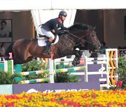 Photo 1, 2:  Member of the HKJC Equestrian Team Kenneth Cheng wins a bronze medal in the third and final leg of the 2013 FEI World Cup Jumping Chinese League in Beijing today (20 Oct).