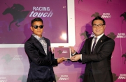 Photos 1, 2:<br>
Superstar and successful racehorse owner Aaron Kwok joins Executive Director of Customer and Marketing of The Hong Kong Jockey Club Richard Cheung (right) to officiate at the launch of an enhanced and innovative iPad application Racing Touch.