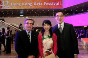Club Chairman T. Brian Stevenson (left) and the Cluba?s Executive Director, Charities, Douglas So (right) pictured with The Hong Kong Jockey Club Scholar and artist Colleen Lee (centre).