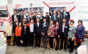 Secretary for Home Affairs Tsang Tak-sing (middle) and Club Executive Director of Corporate Affairs Kim K W Mak (first row, second from left) pose with members of Kwai Tsing District Council.