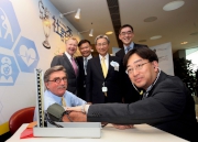 Secretary for Food and Health Dr the Hon Ko Wing-man helps measure the blood pressure of Club Chairman T. Brian Stevenson. (Back row, from left) The Cluba?s Chief Executive Officer Winfried Engelbrecht-Bresges, HA Chief Executive Dr Leung Pak-yin, Chairman Professor John C Y Leong and the Cluba?s Executive Director, Charities, Douglas So.
