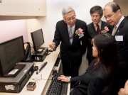 Club Steward Dr Eric Li Ka Cheung (back row, left) tours the Jockey Club Vocational and Educational Resources Centre with Secretary for Labour and Welfare Matthew Cheung (back row, right) and Hong Kong Blind Union President Chong Chan-yau (back row, centre).