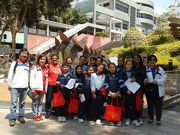 The CARE@HKJC volunteer team accompanies students from grassroots families to visit the exhibition in March.