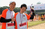 Running enthusiast Pang Mo-keung (right) and his pair-up runner Daniel Leung (left).  They are ranked 9th in the 5-km Challenge Race (Male Group).