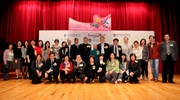 The Jockey Club's Executive Director, Charities, Douglas So (back row, 7th from right) joins Kwun Tong District Council Chairman Bunny Chan (back row, 9th from right), Social Welfare Department Assistant Director (Family & Child Welfare) Caran Wong (front row, 4th from right), Kwun Tong District Social Welfare Officer Peter Ng (back row, 6th from right), Housing Department Kowloon East Regional Management Office Chief Manager Brian Ma (back row, 5th from right), FAMILY Project Principal Investigator Prof T H Lam (back row, 9th from left), Co-Investigator Professor Sophia Chan (back row, 8th from left), CFSC Chairman of the Board Prof Alex Kwan (back row, 10th from left), Chief Executive Officer Kwok Lit Tung (front row, 2nd from left), artistes Tse Suet Sum (back row, 7th from left) and KK Cheung (front row, 4th from left), as well as other guests and representatives of Tsui Ping (South) Estate at the recognition ceremony.